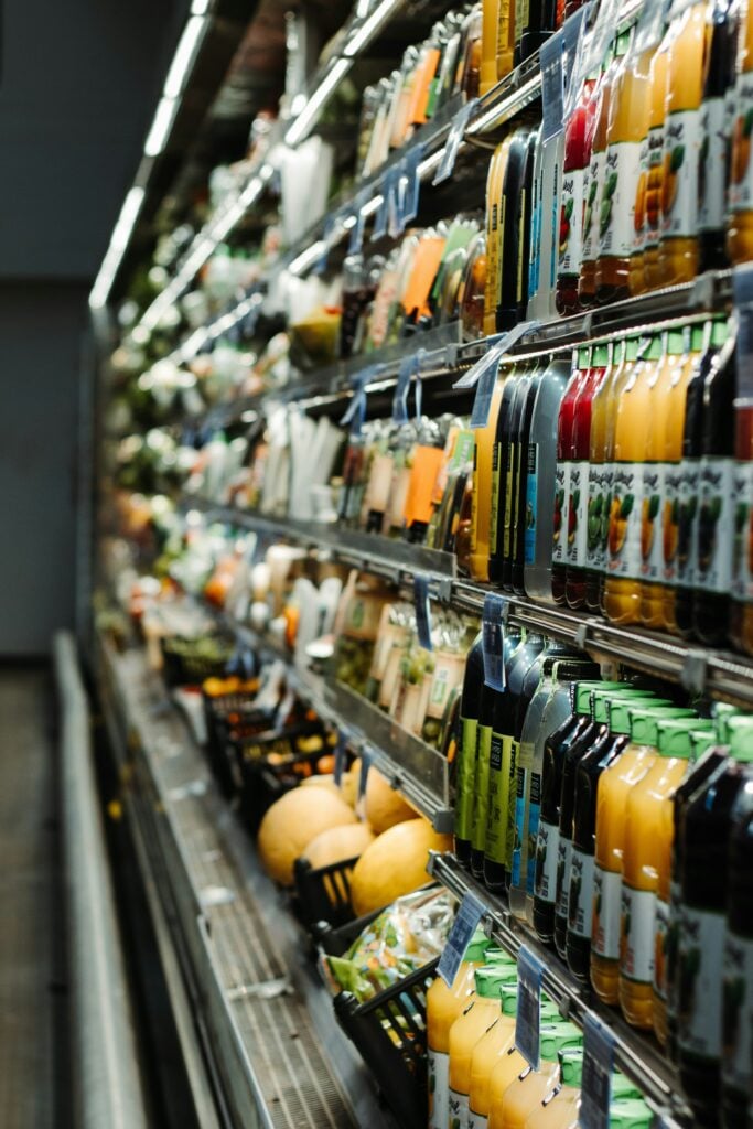 Chiller cabinet in supermarket packed with drinks